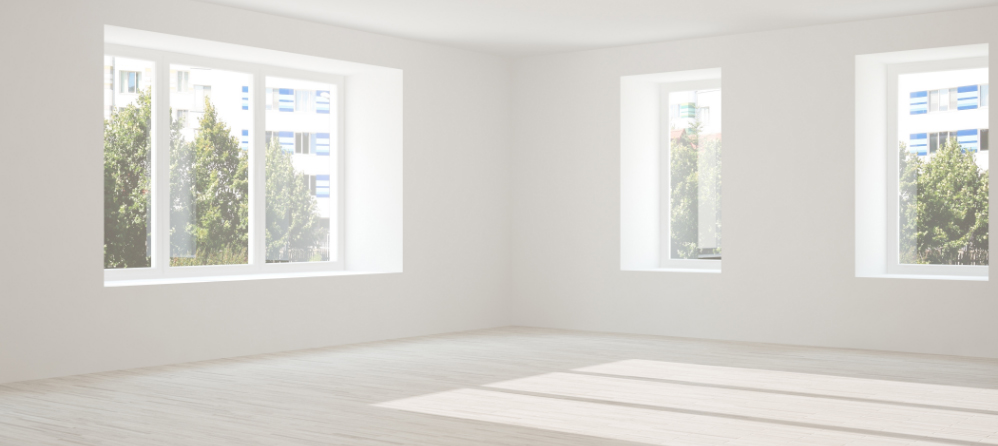 Empty, cleared room with natural light, ready to receive a furniture delivery
