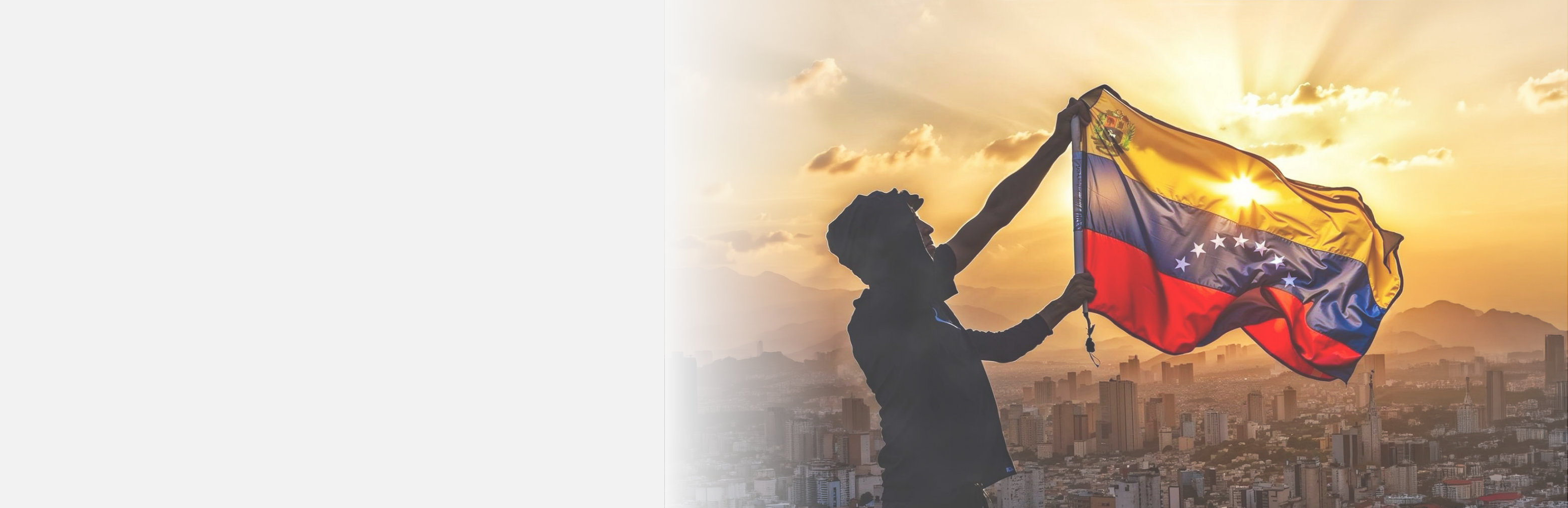 Silhouette of a man raising the Venezuela flag at sunset above the Caracas skyline